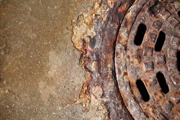 rusty manhole cover with beautiful colours and textures