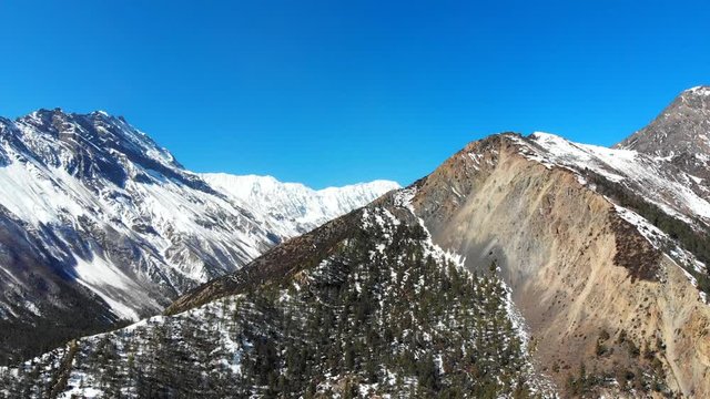 Slider shot of a beautiful landscape with Tilicho peak mountain Himalaya in the backdrop on a bright sunny day.