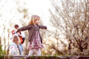Kid stand on top step of stairs, capricious