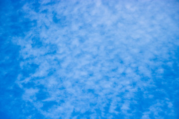 Cirrocumulus clouds in the blue sky. Natural background with copy space for text.