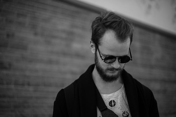 Fototapeta premium A young handsome man. Street style demonstrate 