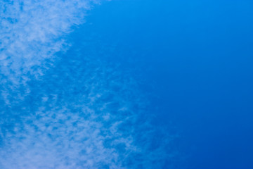 Cirrocumulus clouds in the blue sky. Natural background with copy space for text.