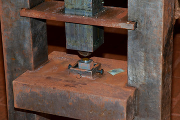 Antique Screw Mint Press in Old Cellar