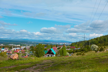 View of the old part of the city of Miassa. It is located in the southern part of the city. In the background you can see the mountain ranges of the southern Urals