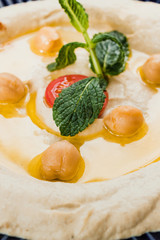Hummus close-up, traditional mediterranean recipe. vertical image