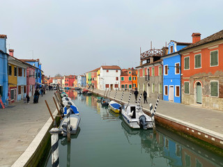 Fototapeta na wymiar Island murano in Venice Italy. View on canal with boat and motorboat water