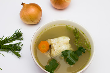 Traditional fish soup. white background. Fish soup is a food made by combining fish or seafood with vegetables and stock