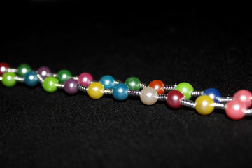 row of colorful Pearl strings abstract background