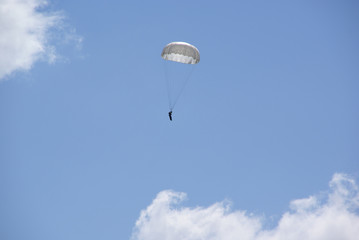 white parachute in the blue sky