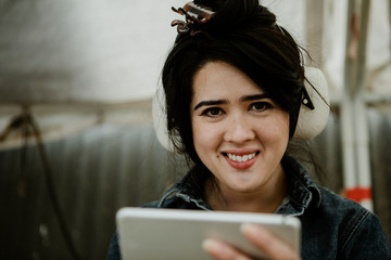 Happy carpenter using a tablet