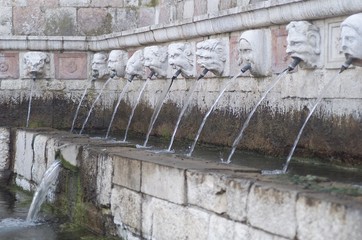 Fountain of the 99 Spouts, Historic fountain with 99 jets distribuited along three walls, L Aquila, Italy