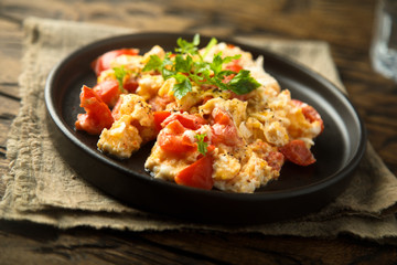 Fototapeta na wymiar Homemade omelette with tomato and herbs