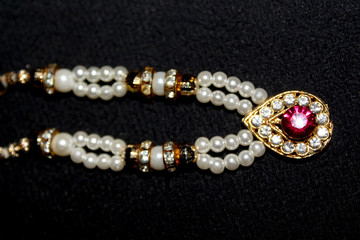 colorful Pearl strings abstract background row of pearl ornaments on black background- Image
