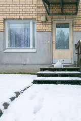 Contactless delivery remained at the door during quarantine. Entrance to the house with a delivered bag. Epidemic Control Coronavirus Prevention