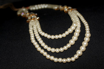 Pearl strings abstract necklace background