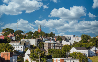A view of buildings on hills in Portland, Maine from the sea