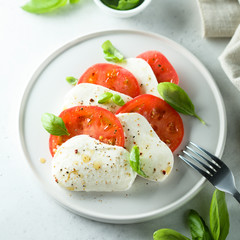 Homemade Caprese salad with tomato, mozzarella and basil