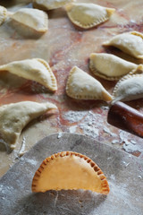 A curry puff is a snack of Southeast Asian origin. It is a small pie consisting of curry with chicken, egg and potatoes in a deep-fried or baked pastry shell. 