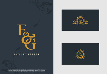 EG logo initial vector mark. Gold color elegant classical symmetric curves decor.