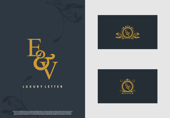 Naklejka na ściany i meble EV logo initial vector mark. Gold color elegant classical symmetric curves decor.