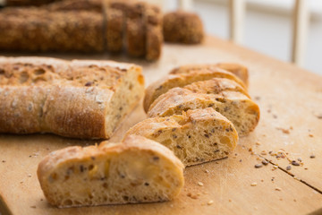 fresh loaf of bread on wooden board