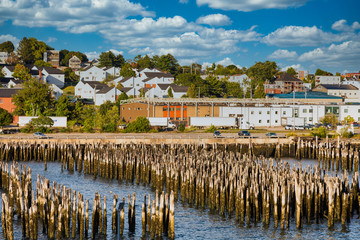 A view of buildings on hills in Portland, Maine from the sea