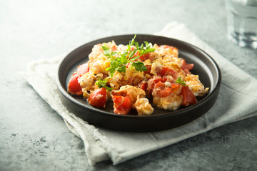 Homemade omelette with tomato and herbs