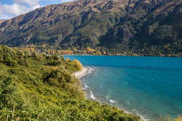 Obraz na płótnie Canvas Blue lake with mountains in the background. Queenstown landscape in New Zealand