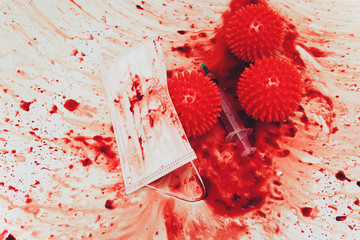 Splashes of blood dripping into the sink in the bathroom. red virus molecules syringe medical mask
