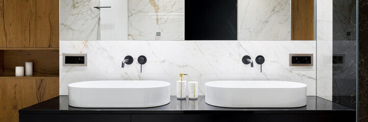 Elegant bathroom with two washbasins, panorama