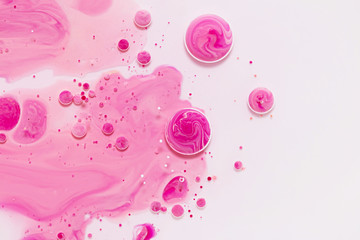 Fluid art texture. Background with abstract mixing paint effect. Liquid acrylic picture with artistic mixed paints. Can be used for baner or wallpaper. Pink and white overflowing colors
