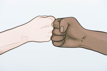 picture with drawn multiethnic hands doing fist bump