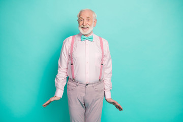 I'm ready. Photo of funny grandpa good mood listen cool news black friday season addicted shopper wear pink shirt suspenders bow tie pants isolated teal color background