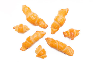 Croissants isolated on white background. Fresh homemade cakes. Buns, culinary composition.