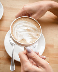 Coffee ground in hands, latte, cappuccino
