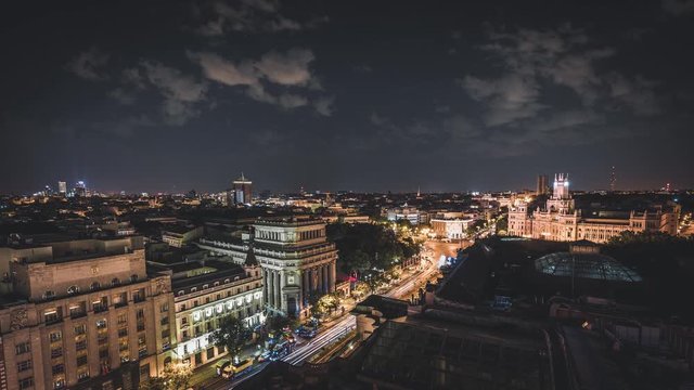 4K Night Timelapse Video clip view of city central Madrid. Architectural landmark Metropolis building and traffic on Gran Via street, Spain.