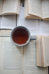 Fototapeta premium cup of coffee and book
