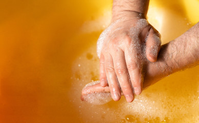 hand  washing in water with soap suds