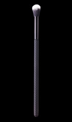 Cosmetic makeup eyeshadow brush isolated on a black background