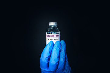 Coronavirus Covid-19 Protection and Vaccine. Medicine bottle for injection medical glass vials for...