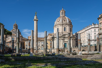 Fototapeta na wymiar Colonna Traiana and Chiesa dei Fori, Fori Imperiali, Roma, Italy