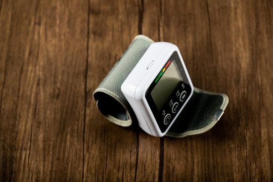 Tech device showing medical instructions on a wooden table
