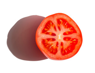 half of a four-chamber red tomato on a white background with a shadow