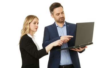 Fototapeta na wymiar Businesswoman and businessman looking at his laptop screen.