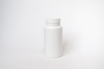 white jar of talc empty on white background for depilation and sugaring