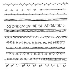 set of hand drawn dividers borders in black and white