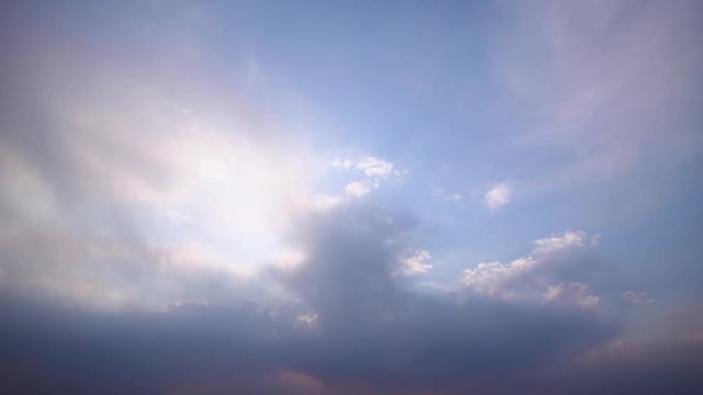 4k timelapse gentle colors of flying clouds illuminated by sunset