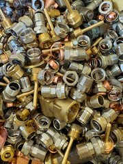 Honey brass scrap ready to be recycled,  portrait view 