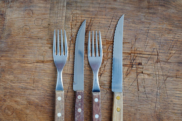 knifes and forks with a wooden handle