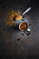 Cup of strong turkish coffee and cane sugar on rustic background. Copy space